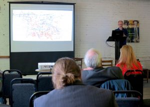 Todd Swindell with Harold Norse’s Cosmograph painting